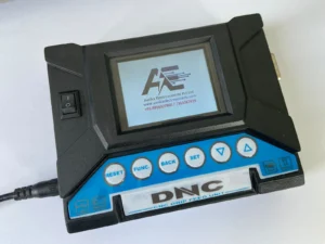 DNC USB (DNC Titan) device installed on a Fanuc CNC machine for USB-based NC program transfer in CNC and VMC machining applications.